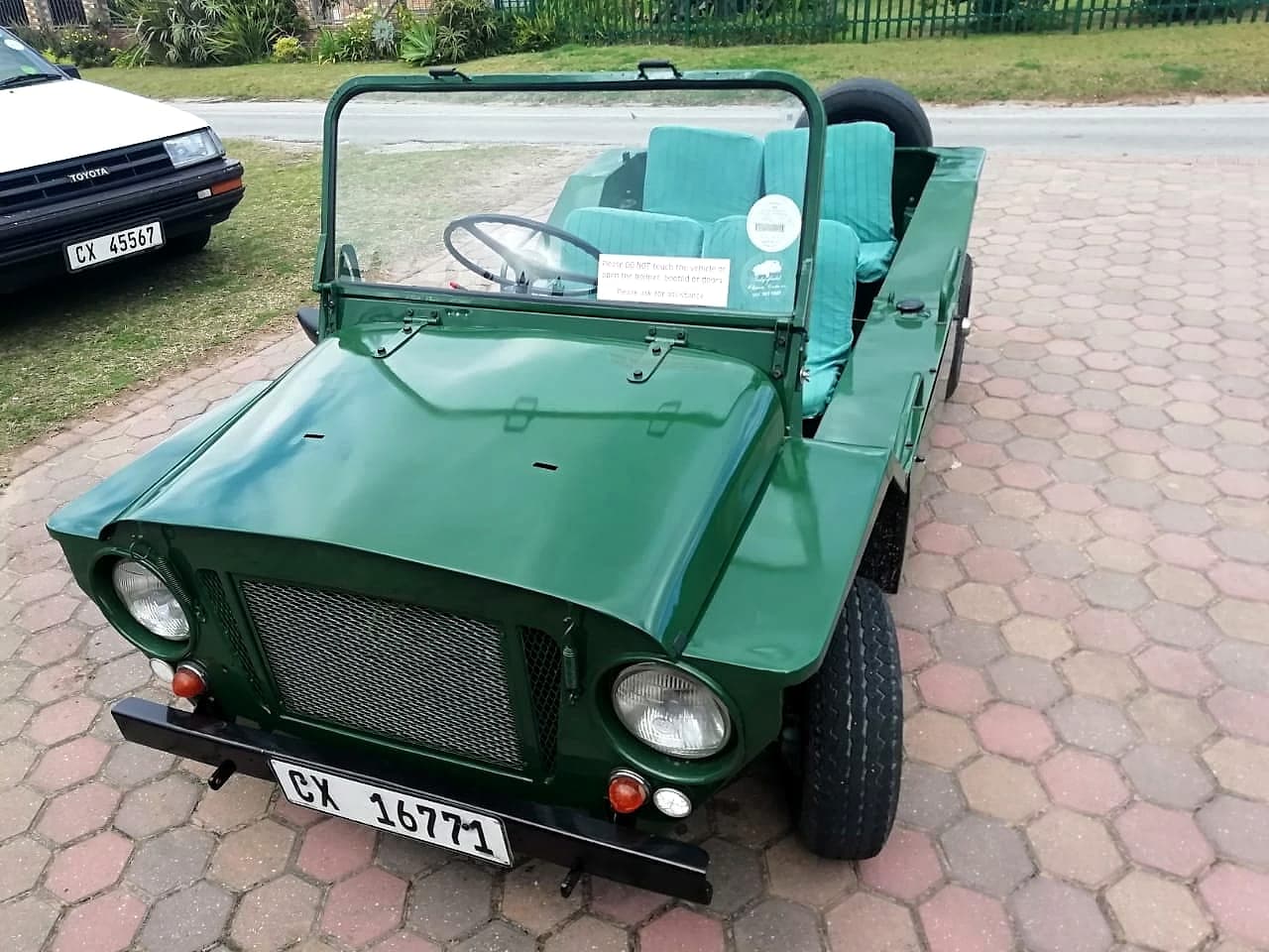 Restored green Mini Moke with Cape Town plates